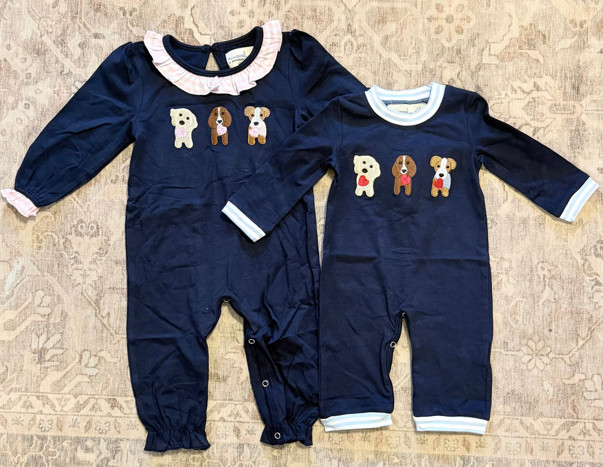 Boys navy long-sleeve rompers with puppy dog prints and striped cuffs, snap legs