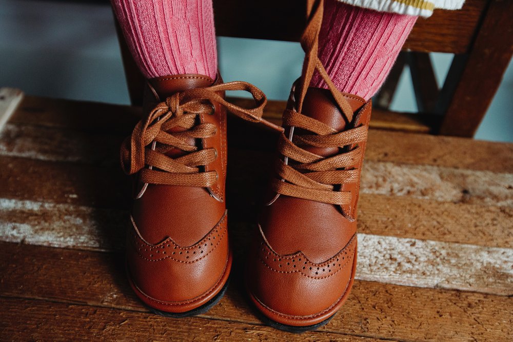 Chestnut kids lace-up boots with stitched uppers and flexible sole