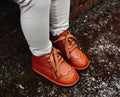 Chestnut kids lace-up boots worn, tied laces, stitched toe and panel details