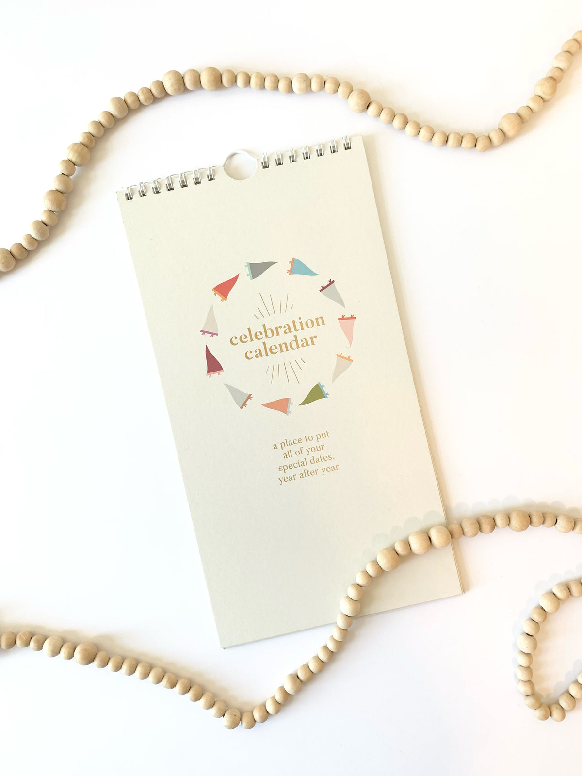 Celebration calendar card with celebration calendar logo and hang-hole top
