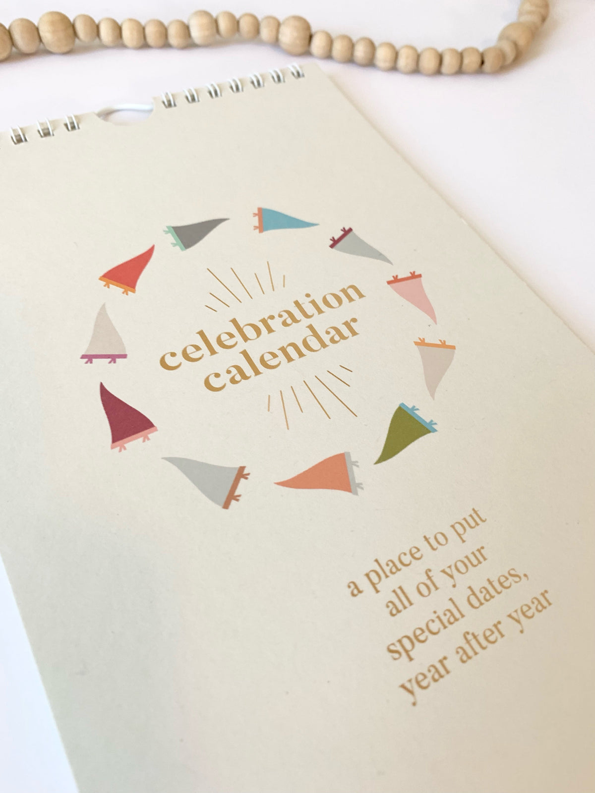 Celebration calendar cover card with wreath graphic and a place to put text