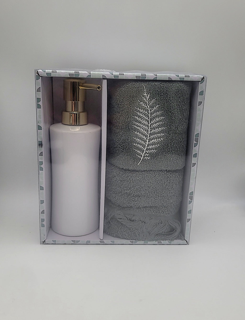 Open box set with soap pump bottle and two gray-green towels featuring fern leaf embroidery