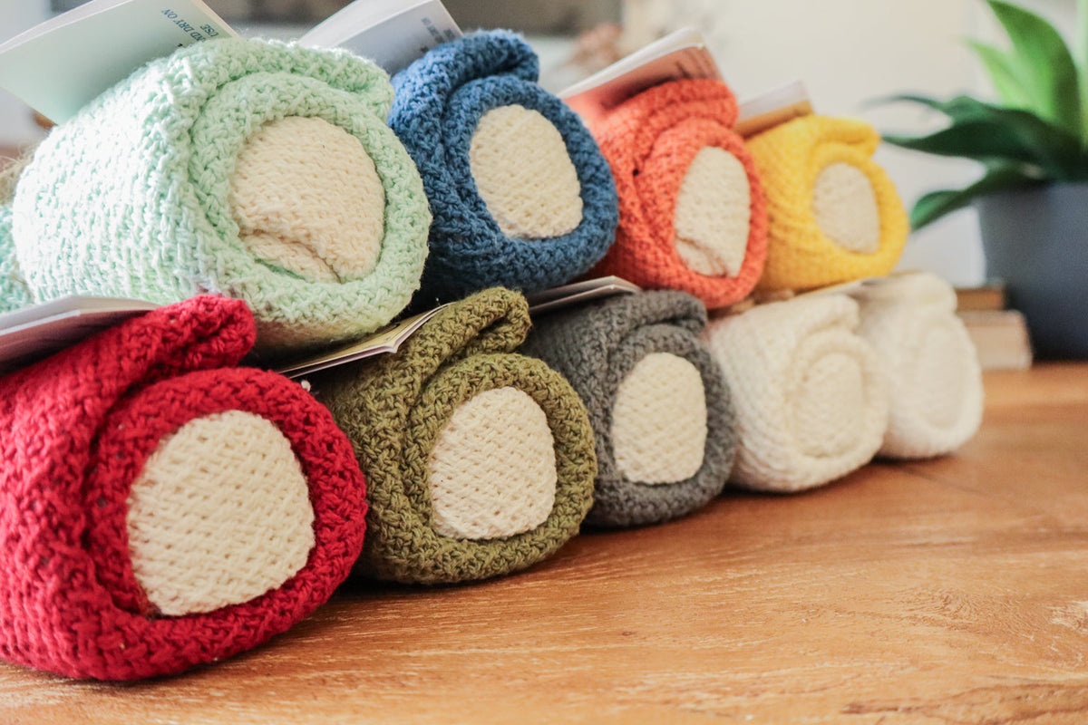 Cotton dishcloth variety, folded 11" x 11" cloths in mint, teal, red, and natural