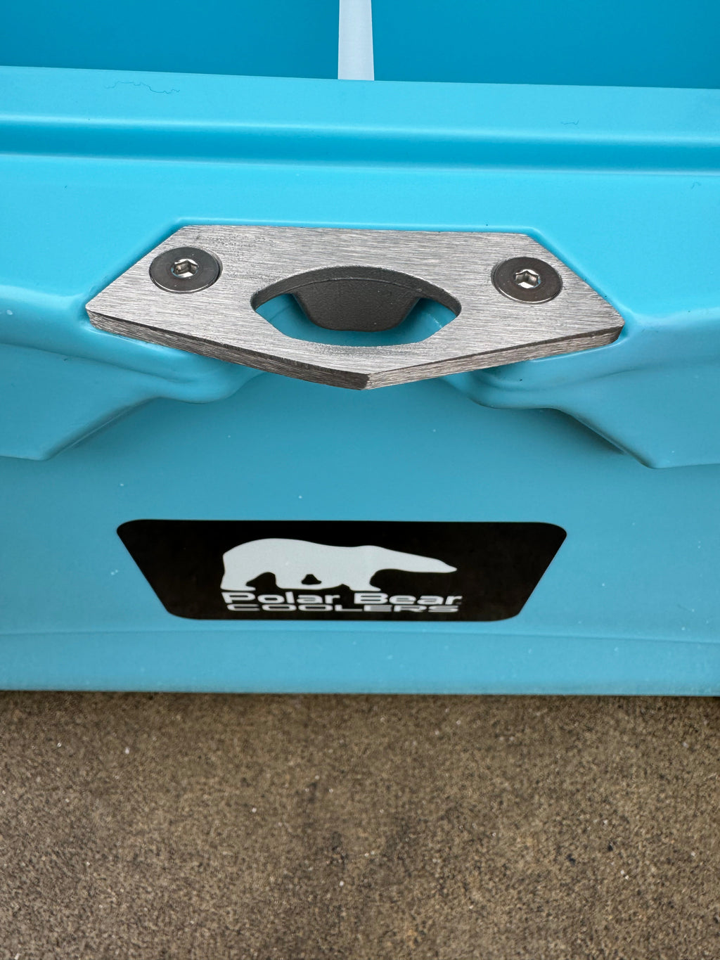 Caribbean blue cooler front tie-down plate with Polar Bear Coolers logo label