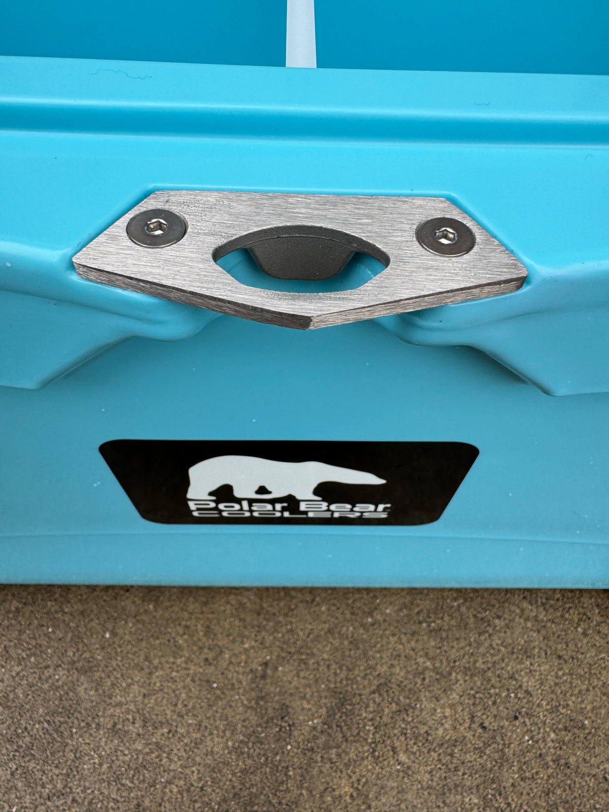 Caribbean blue cooler front tie-down plate with Polar Bear Coolers logo label