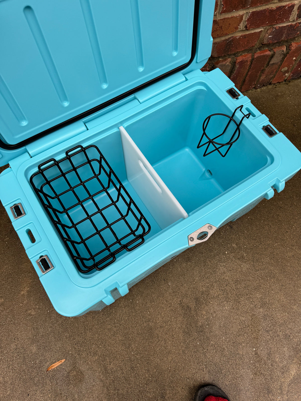 Polar Bear 45 hard cooler, open turquoise lid with black wire basket
