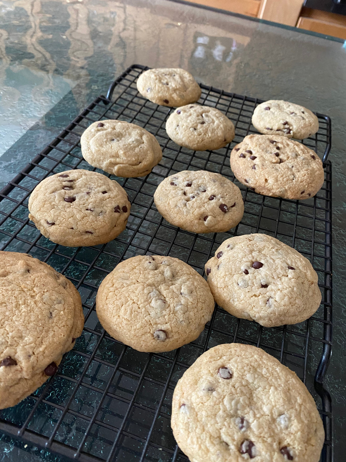 Assorted gluten-free cookies cooling on a wire rack