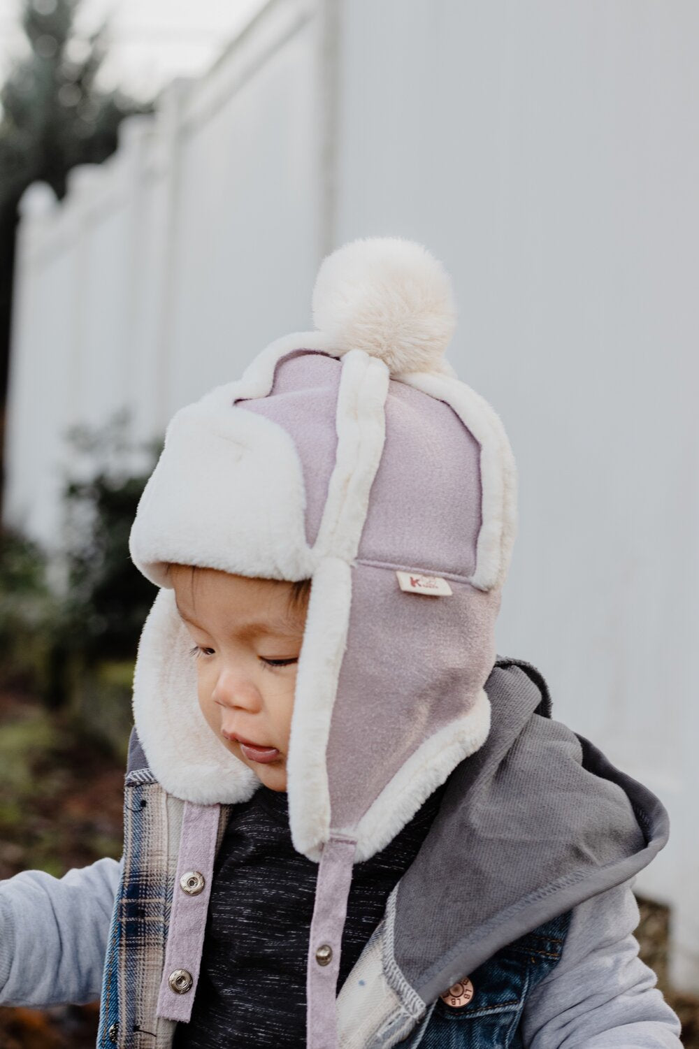 Kids sherpa aviator winter hat with ear flaps, white fleece trim and mauve/pale purple panel