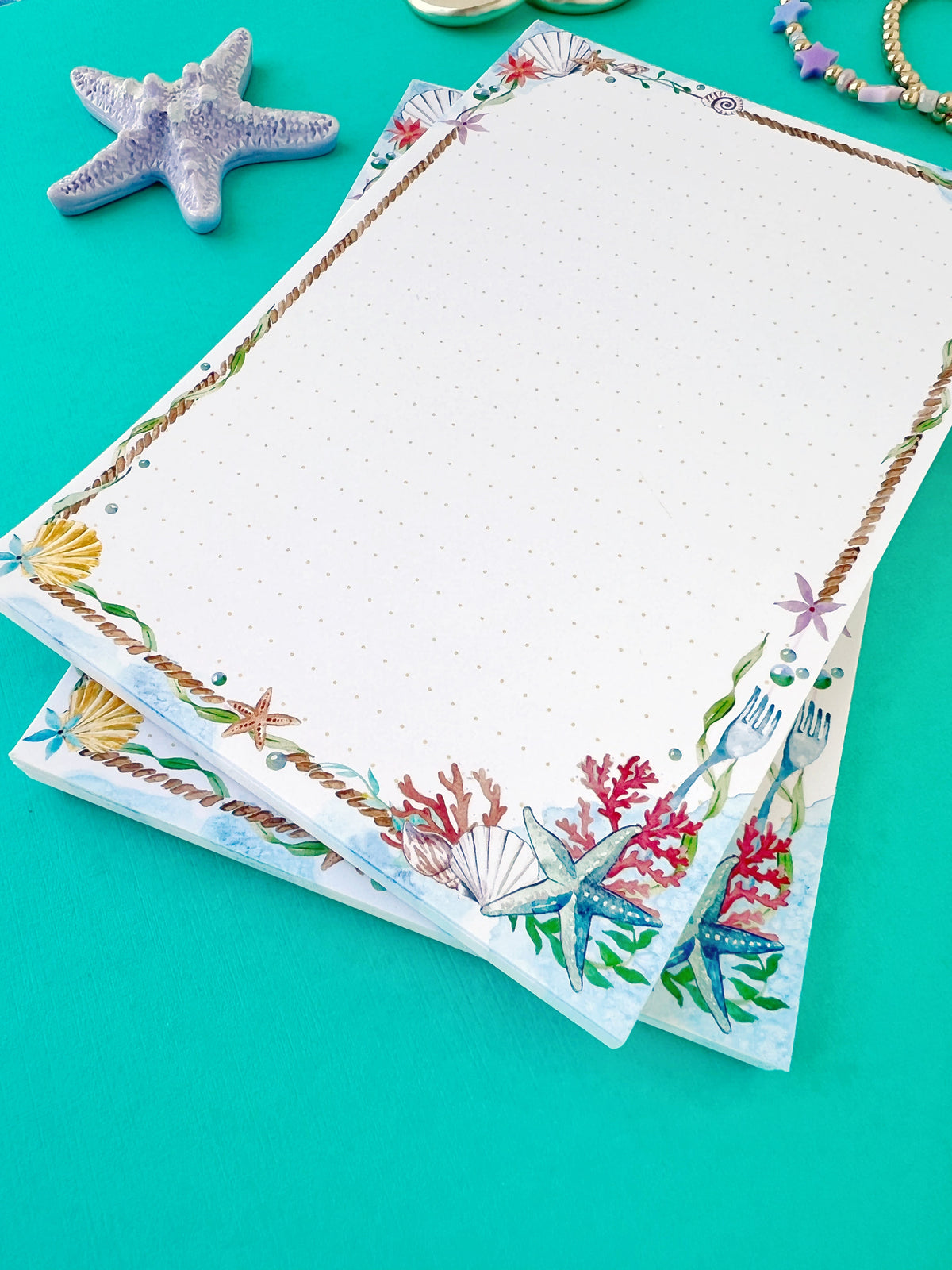 Sea-themed memo notepad page with floral coral border and dotted lines