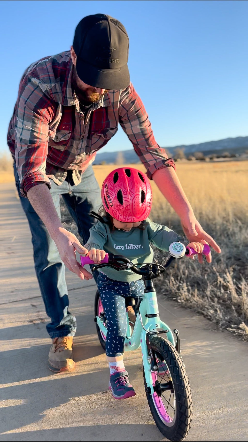 Teal crewneck pullover on a child, long sleeves and ribbed hem.