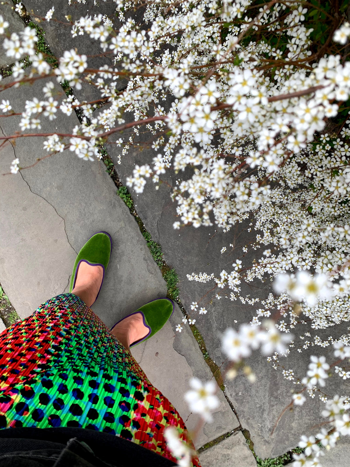 Green slip-on slippers with suede-like uppers and flat soles