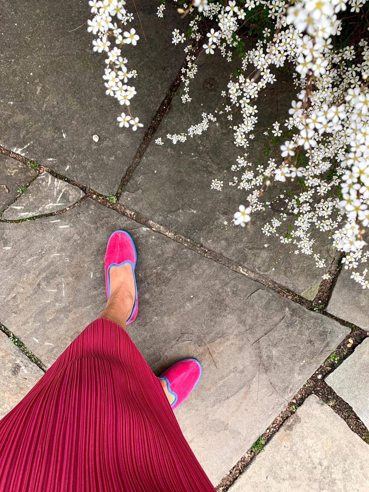 Pink slip-on slippers with suede-like uppers and flat soles