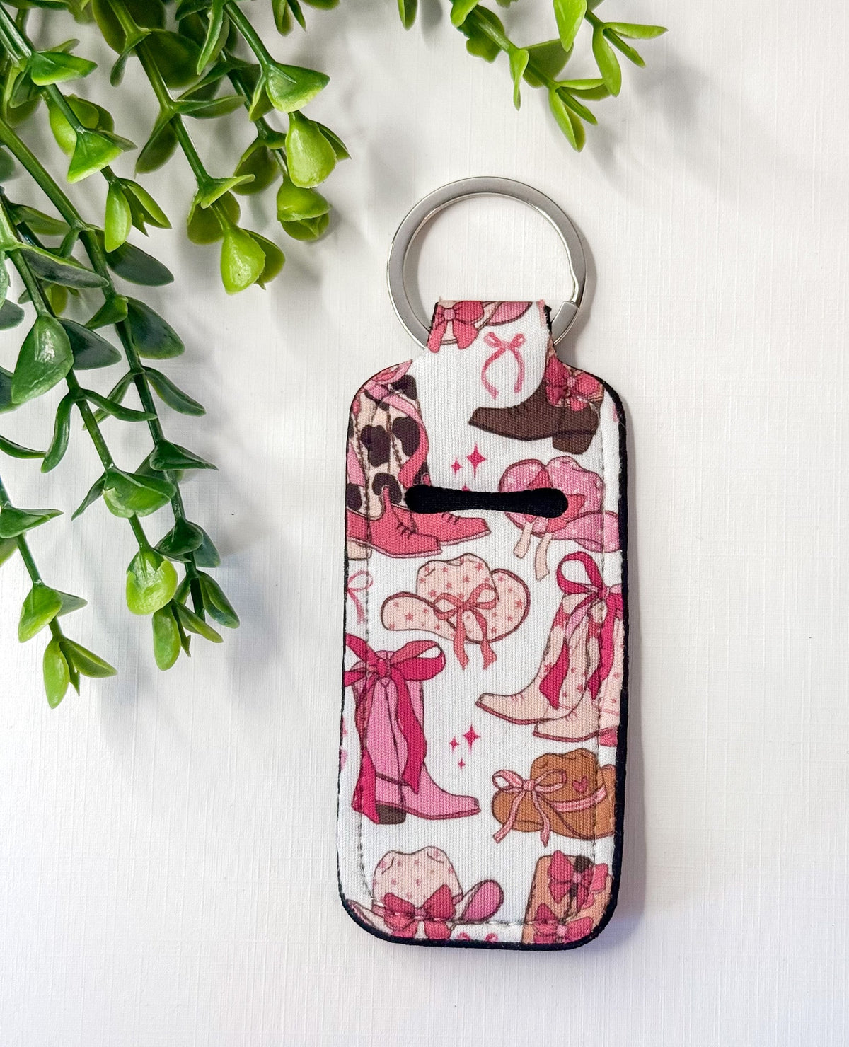 Chapstick holder keychain with pink and cream cat and bow print, metal key ring