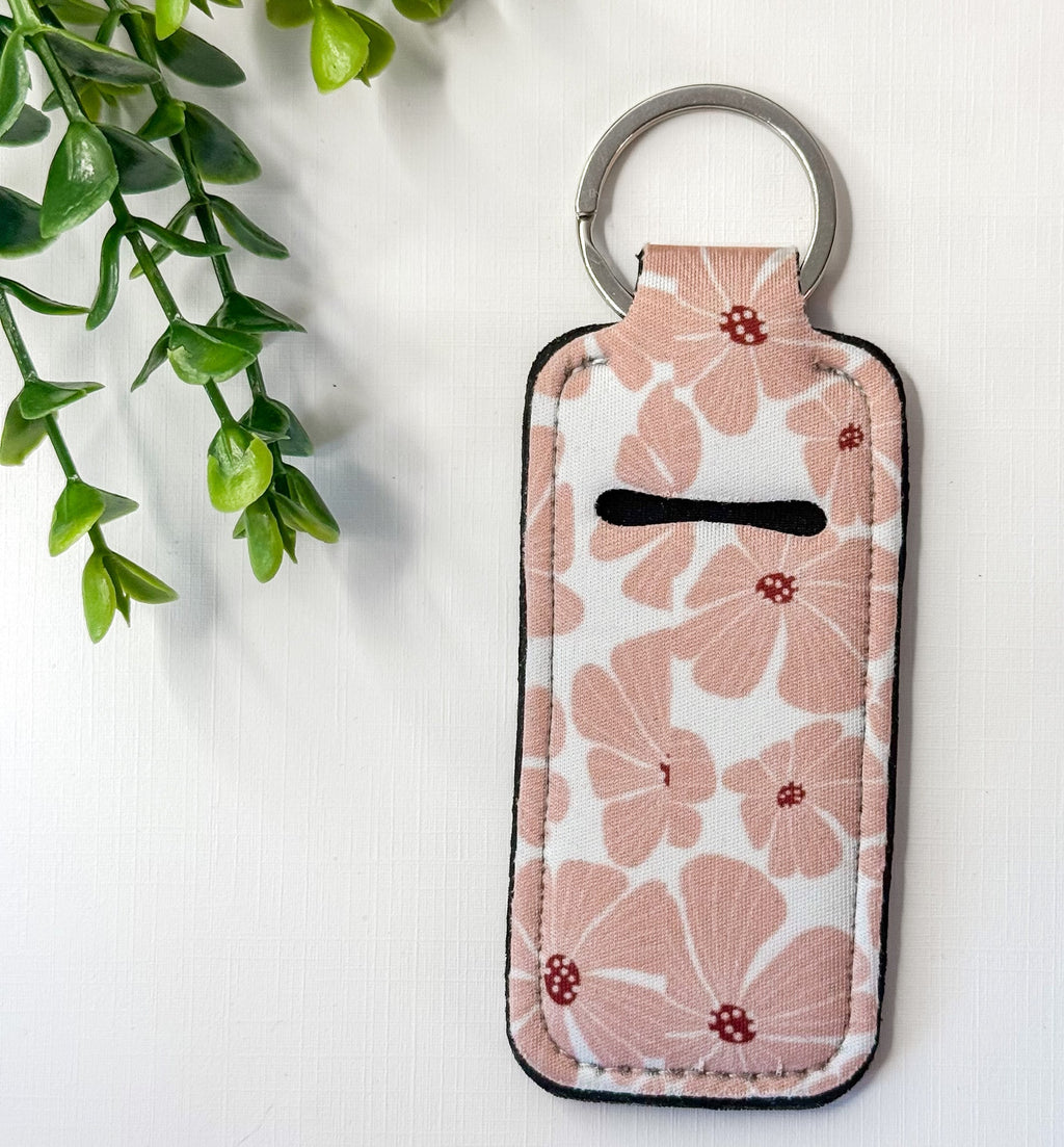 Chapstick holder keychain with blush floral leaf print and black top stripe, key ring