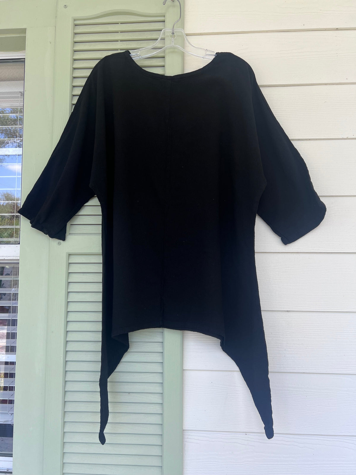 Women's cotton gauze Angela top in dark navy/black, front view with flared sleeves