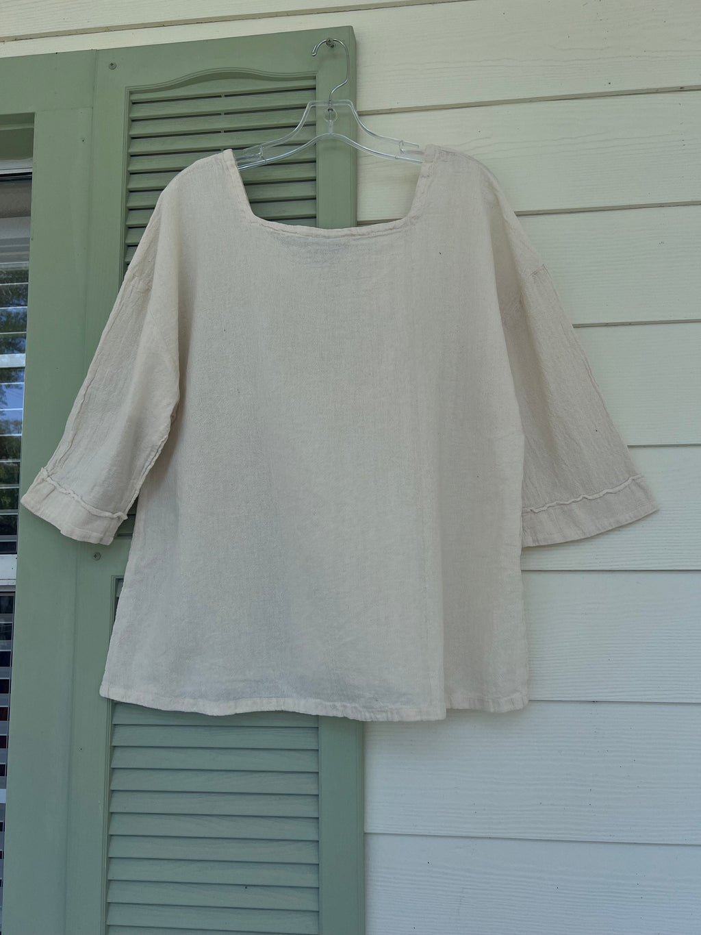 Elena cotton gauze top in pale gray on hanger, relaxed drape, scoop neck