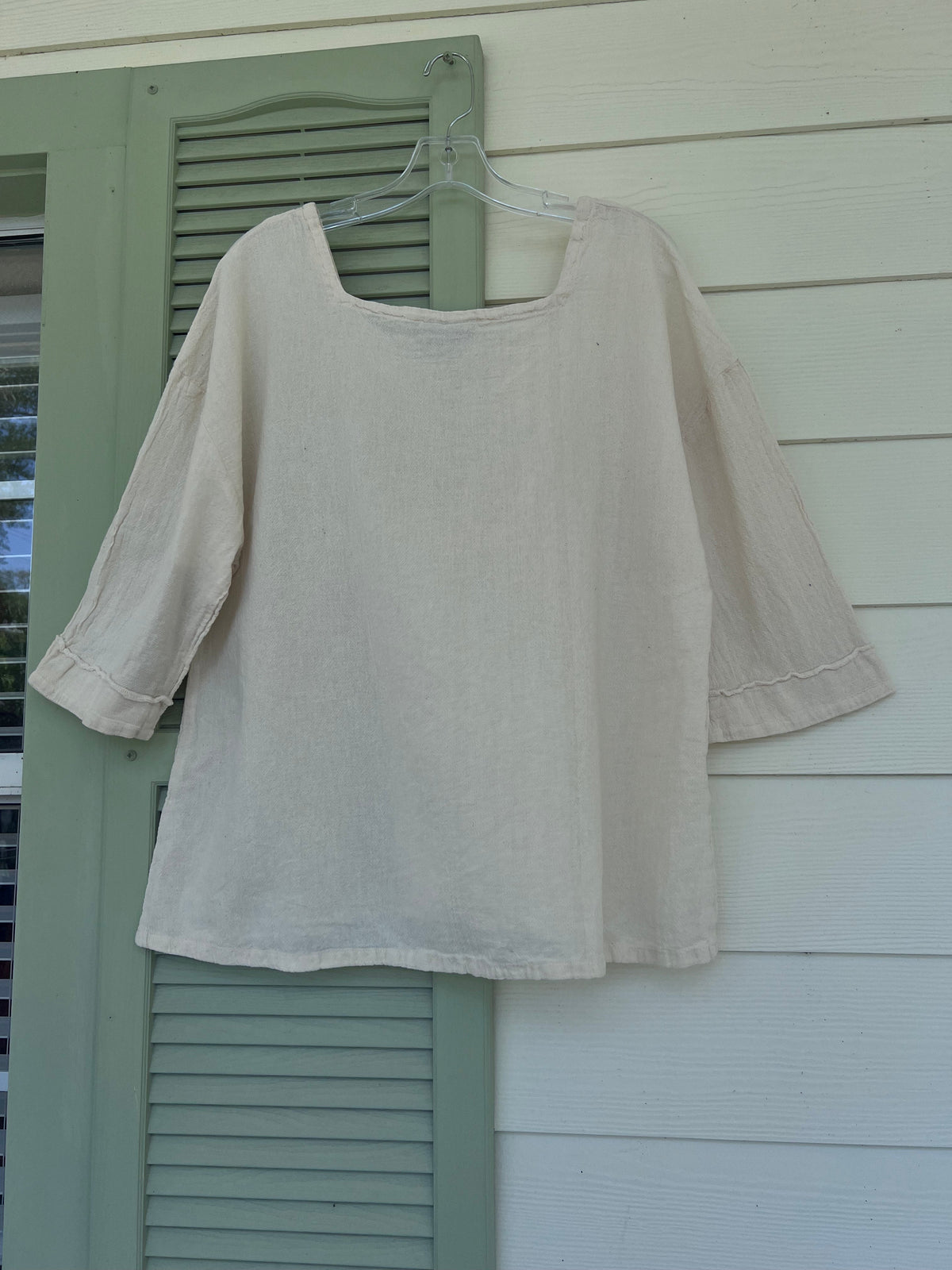 Elena cotton gauze top in pale gray on hanger, relaxed drape, scoop neck
