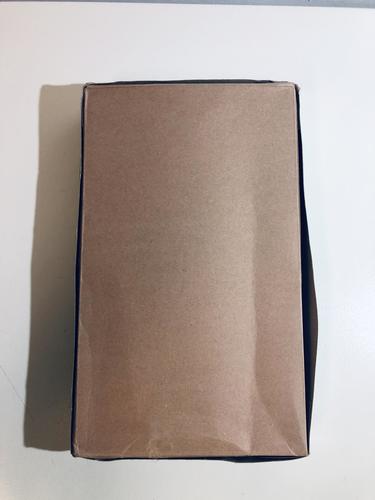 Cardboard shipping box holding legal hanging file folders, brown paper exterior