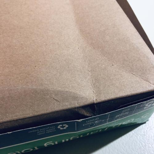 Top corner of box showing printed product details along the edge