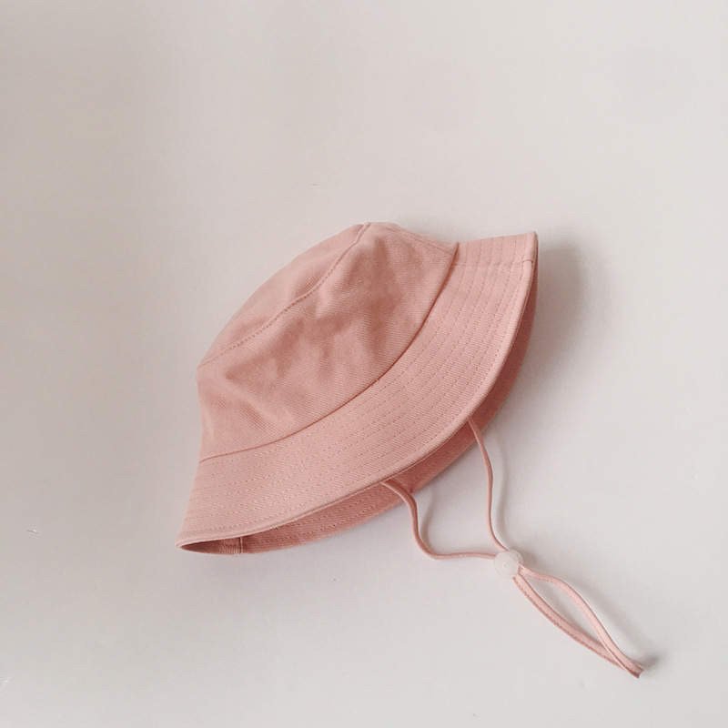 Pink kids linen fisherman bucket hat with wide brim and adjustable chin strap
