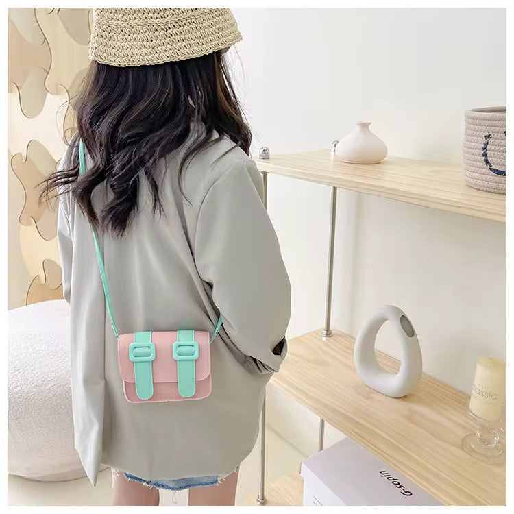 Kids mini satchel bag, light teal with two buckle straps, crossbody.