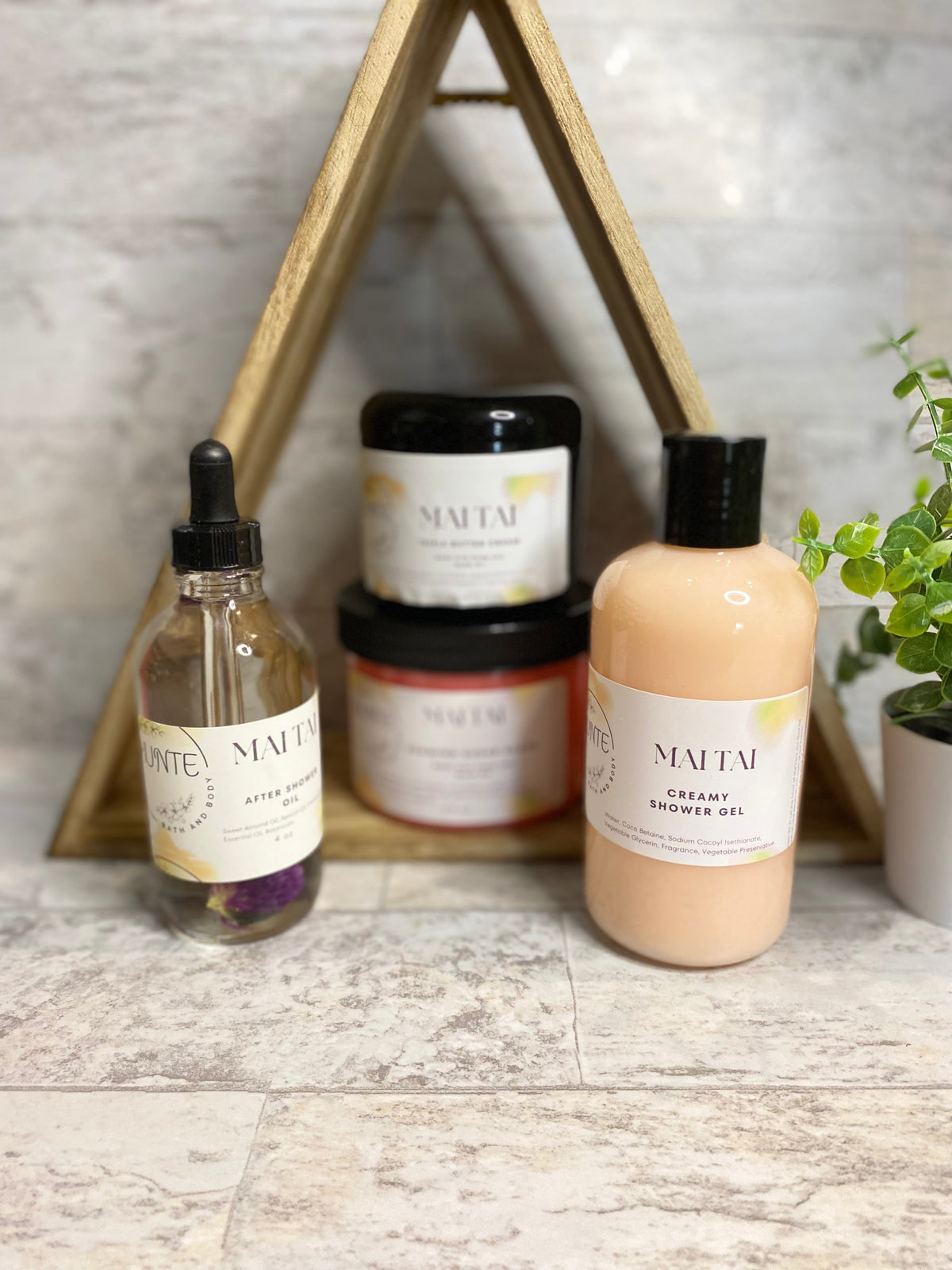 Mai Tai bath set bundle: cream shower gel bottle, scrub jar, and oil vial.
