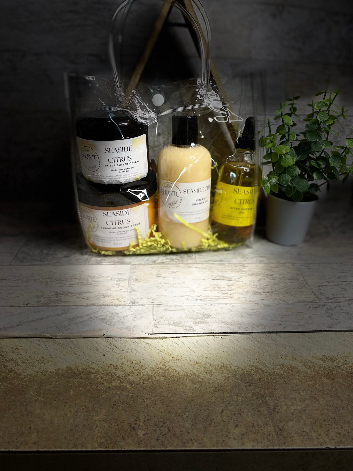 Seaside Citrus bath set bundle in clear bag: black jars, yellow gel bottle, and oil.