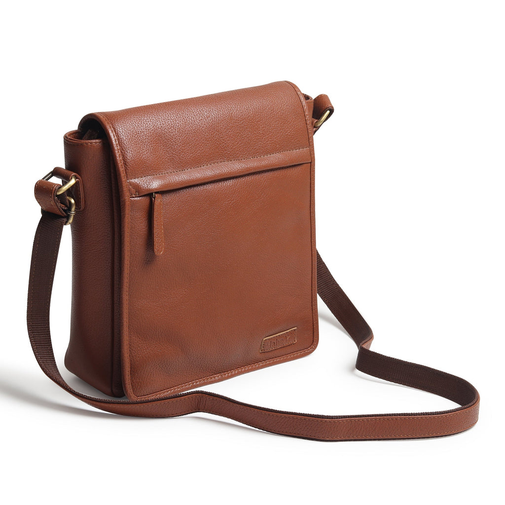 Brown leather crossbody bag with flap closure and long adjustable strap