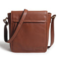 Brown leather crossbody bag with flap front and adjustable shoulder strap