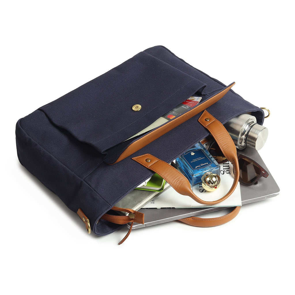 Navy canvas briefcase open top with tan leather trim and pockets