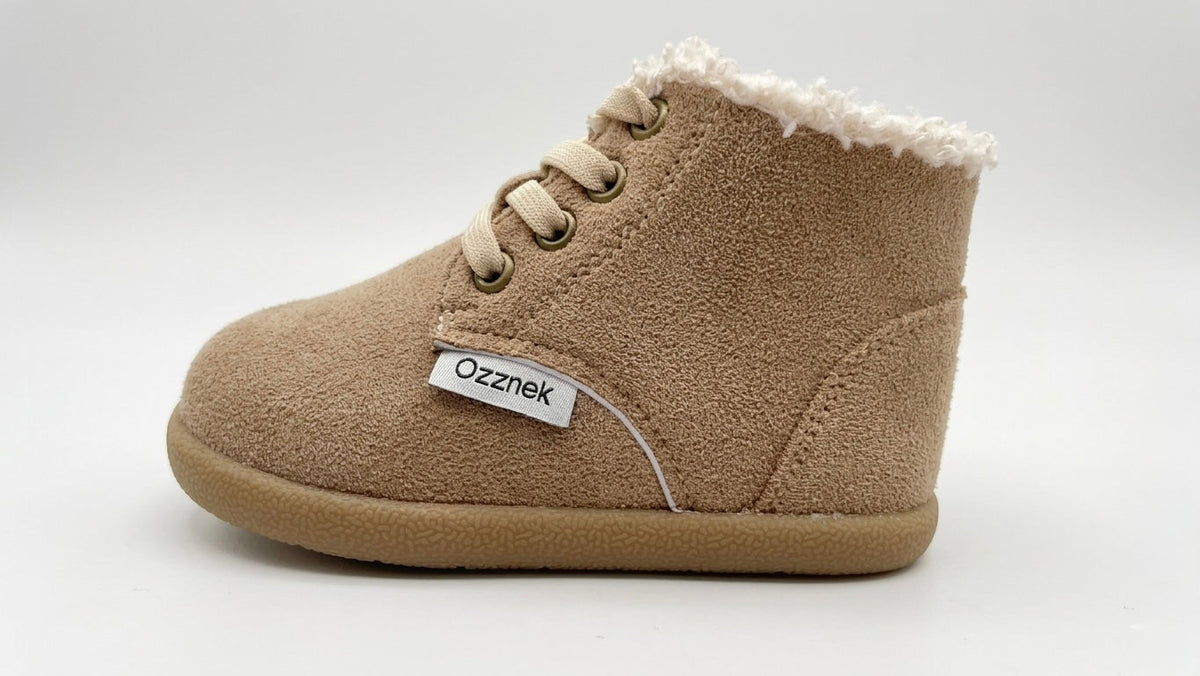 Tan toddler winter barefoot boots with lace-up closure and fuzzy sherpa lining
