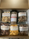 Pet treat gift box with mixed freeze-dried dog treats and a flavor boost jar