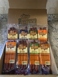 Artas'n Eight beef stick variety pack in clear bags inside a cardboard box