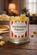Hot buttered popcorn candle in clear glass jar with popcorn wax pieces and paper label