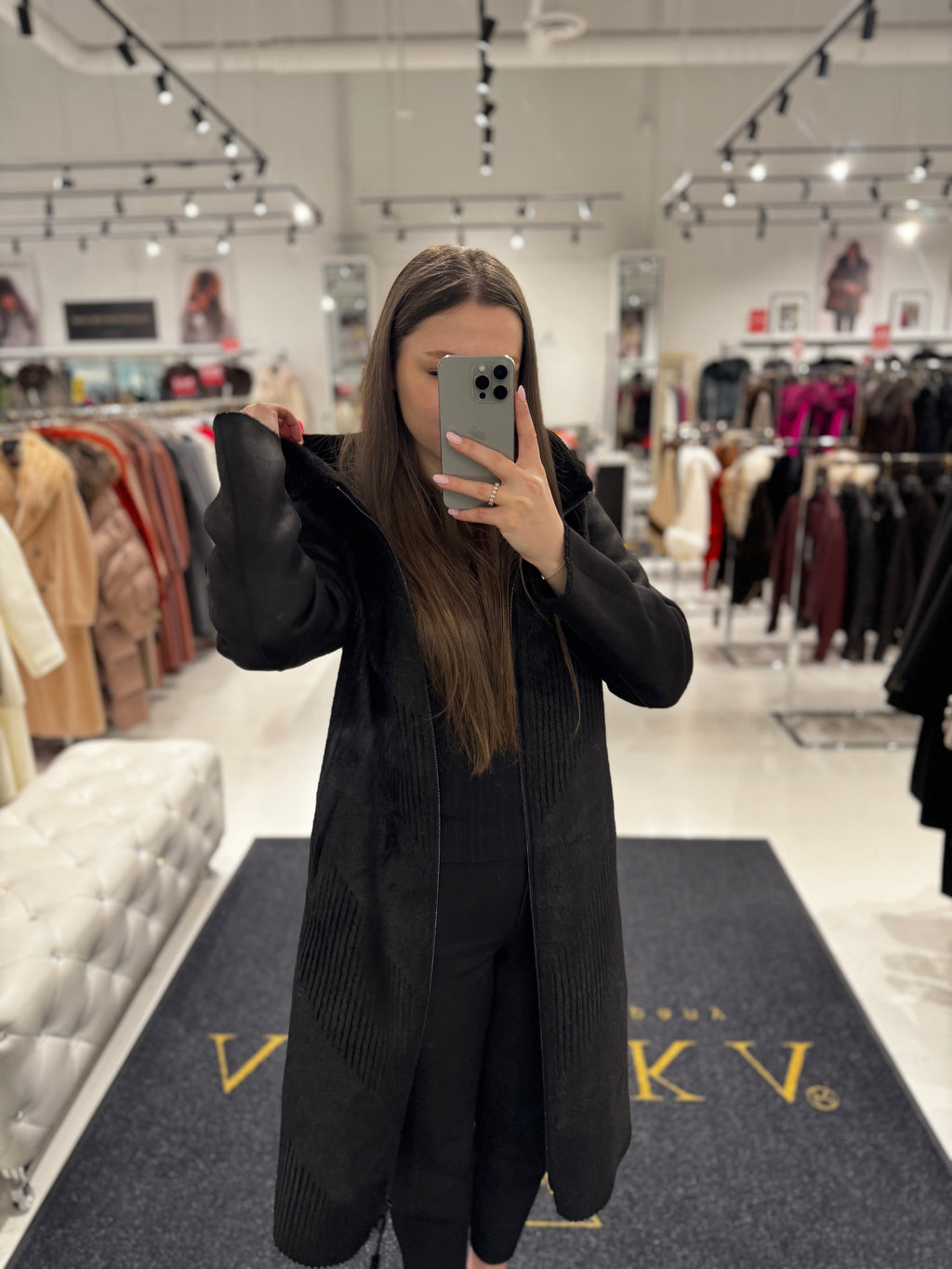 Black hooded reversible faux fur coat with long length and front zipper