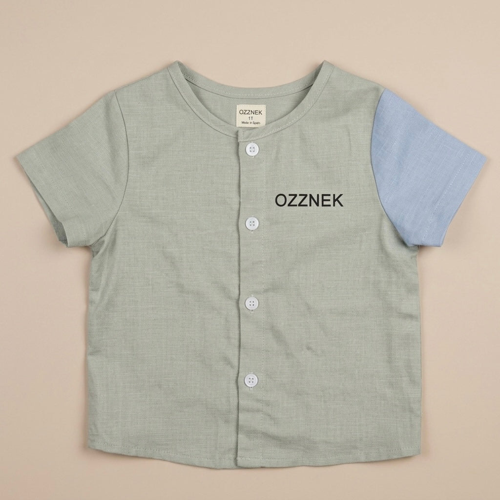 Toddler linen button-up shirt, sage green with blue sleeves and button placket; OZZNEK