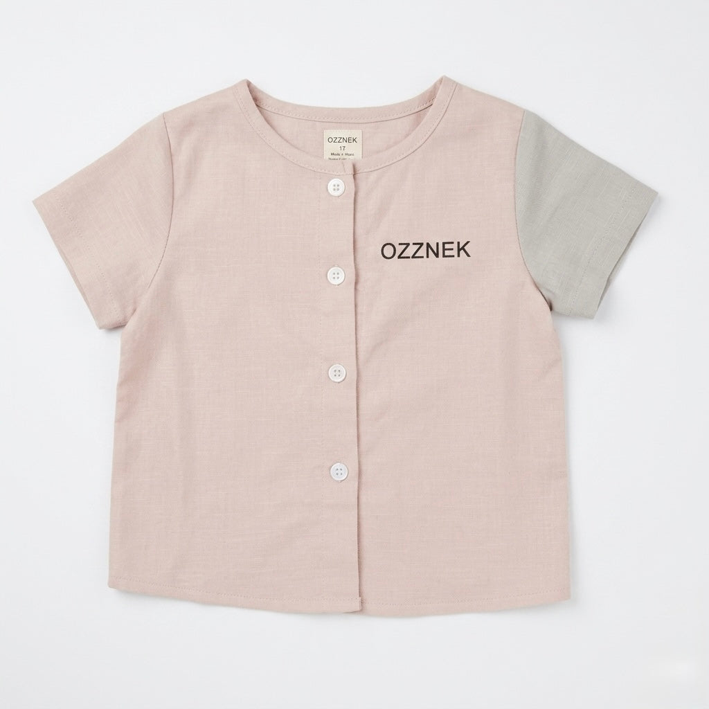 Toddler button-up shirt, light oatmeal pink, short sleeves, front button placket