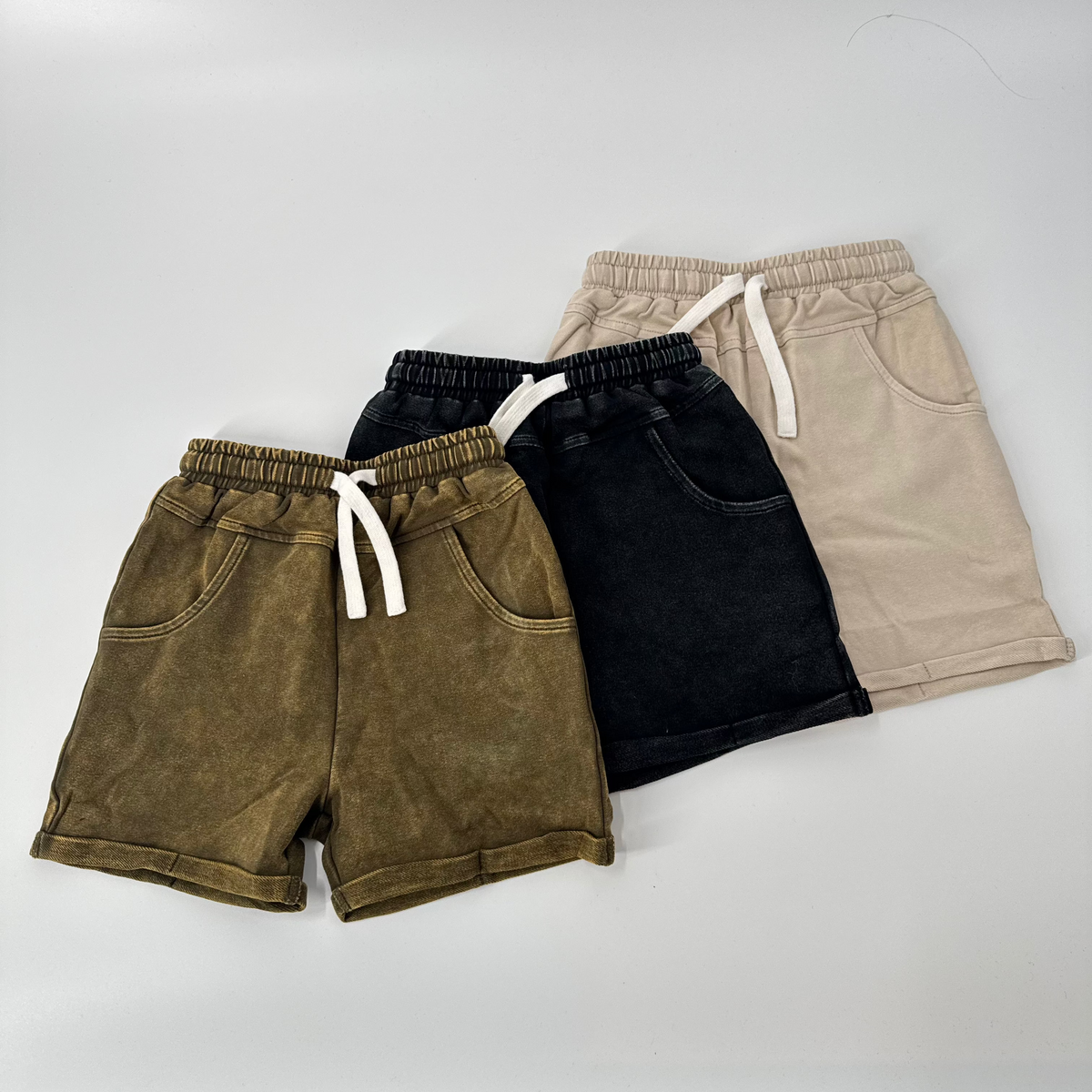 Khaki and dark vintage wash shorts with elastic drawstring waistband and side pockets
