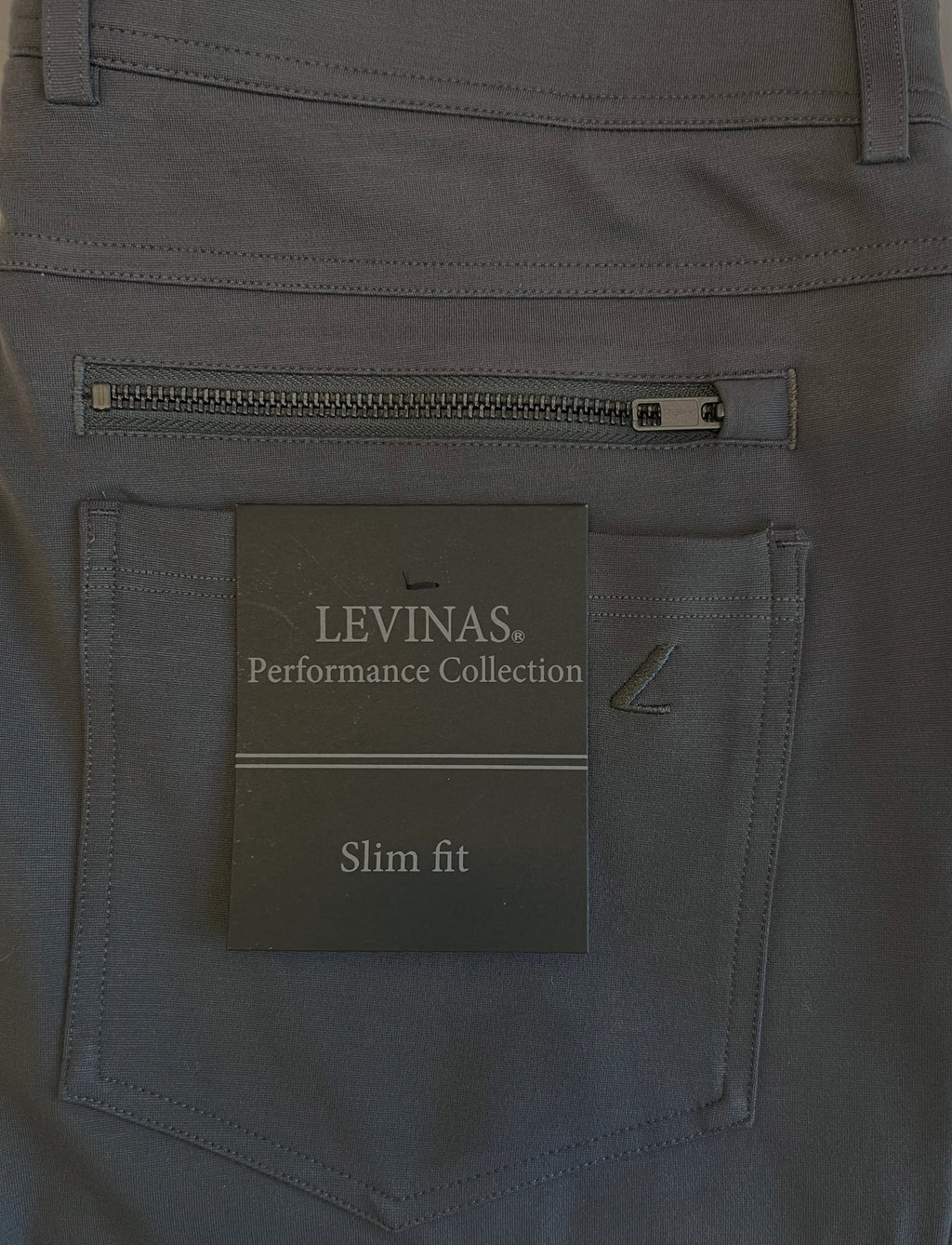 Dark charcoal chino coin pocket with logo patch and zipper closure