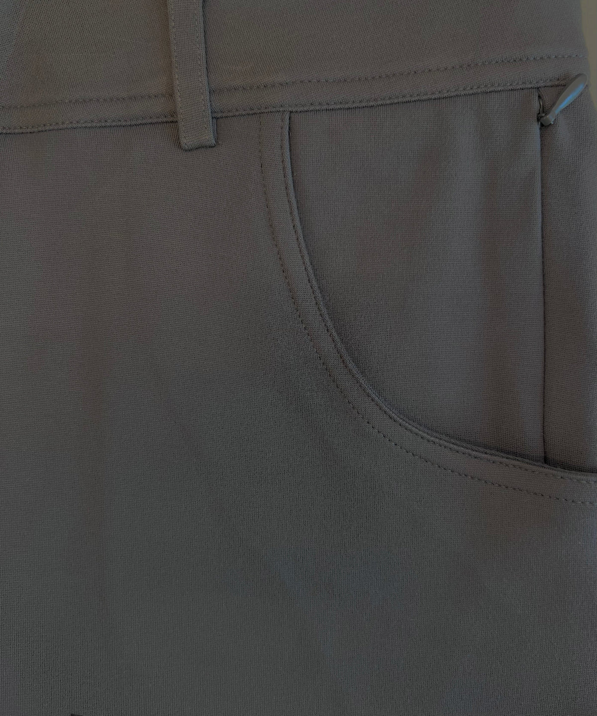 Dark charcoal stretch chino pocket and curved seam stitching detail