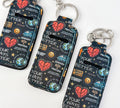 Dark patterned chapstick holder pouch with keyring, hearts, smiley, and slogan print