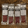 Bison meat stick pack with four vacuum-sealed flavor packs
