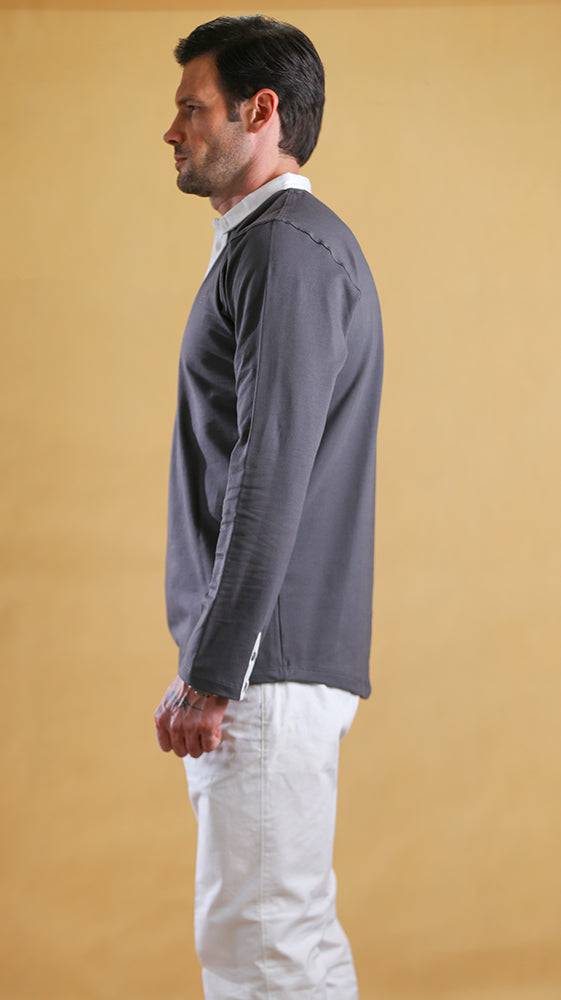 Grey polo shirt with contrast white collar and long sleeves, side view