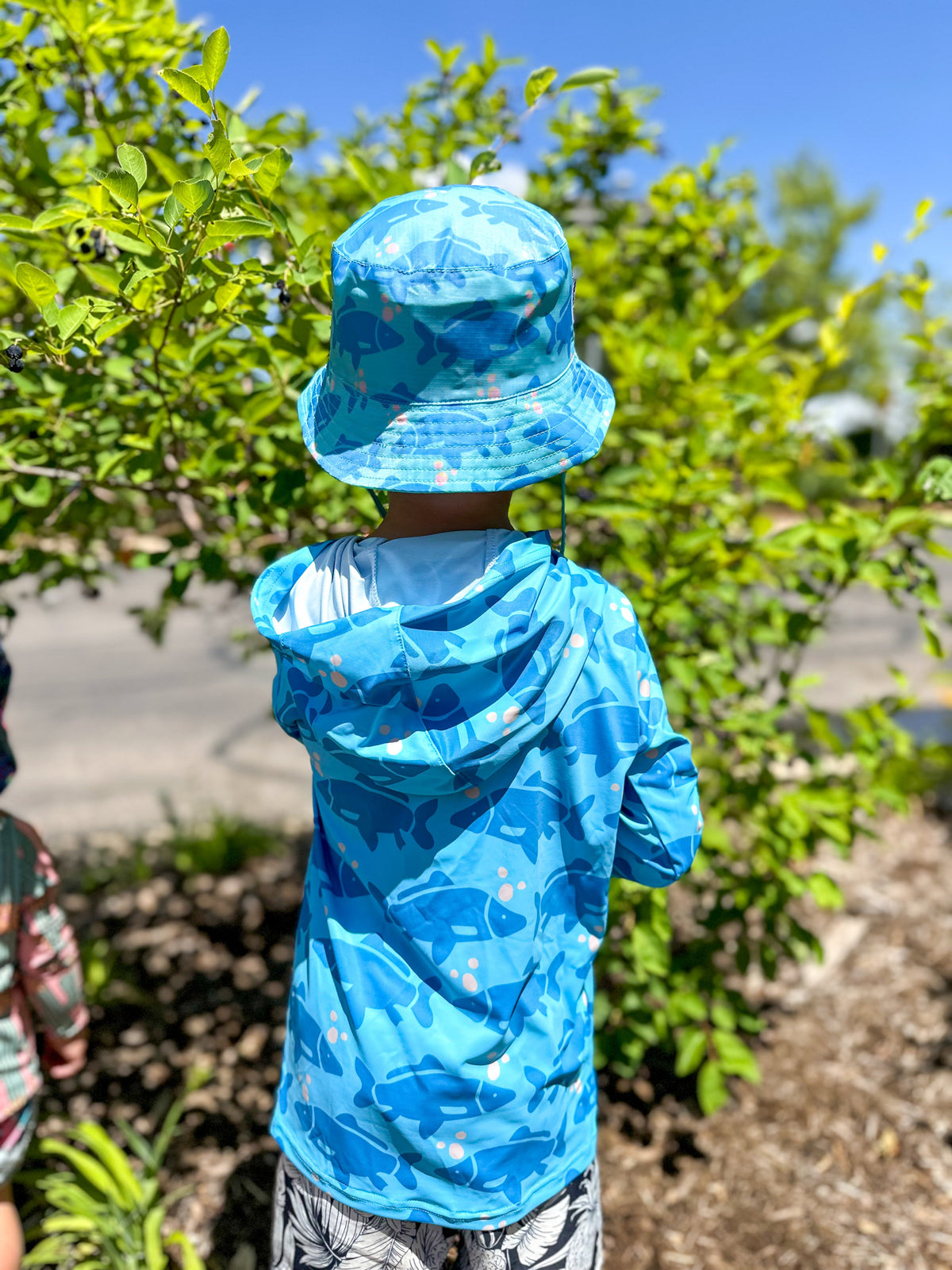 Kids sun hoodie in blue camo print, hooded long sleeves with front pocket