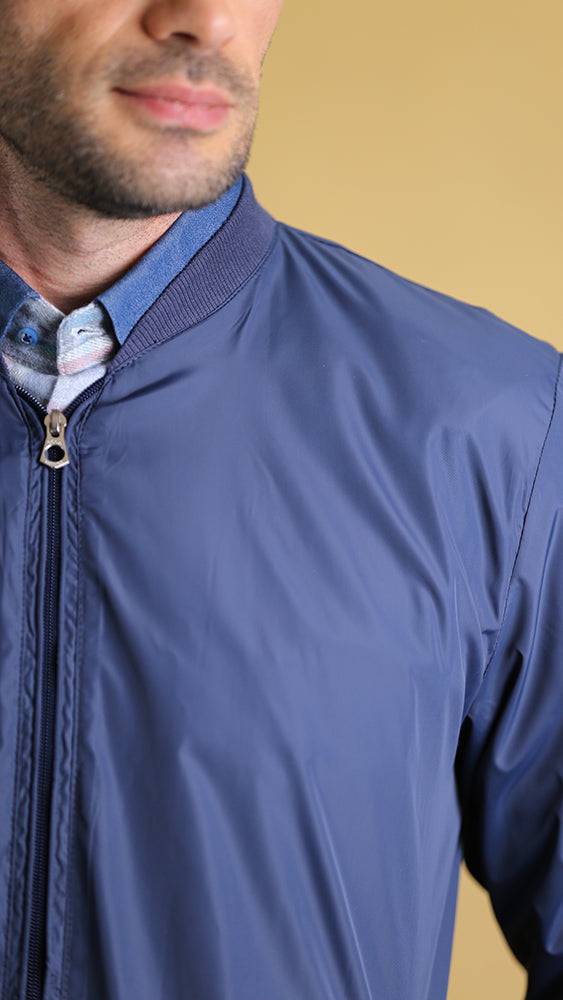 Dark blue lightweight jacket with stand collar and visible full-zip front
