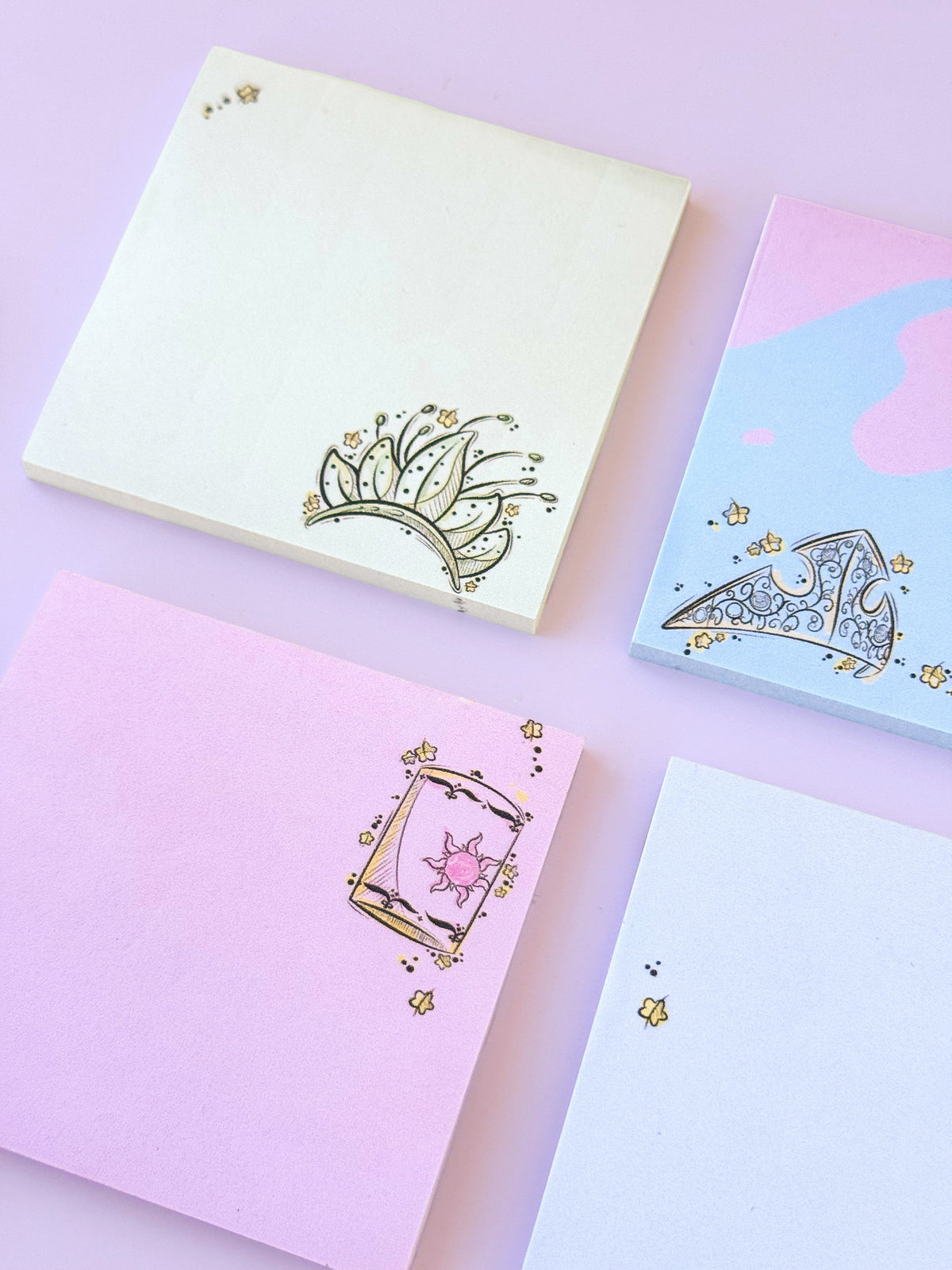 Pastel sticky notes with ornate princess crown and carriage sketch designs, square set.