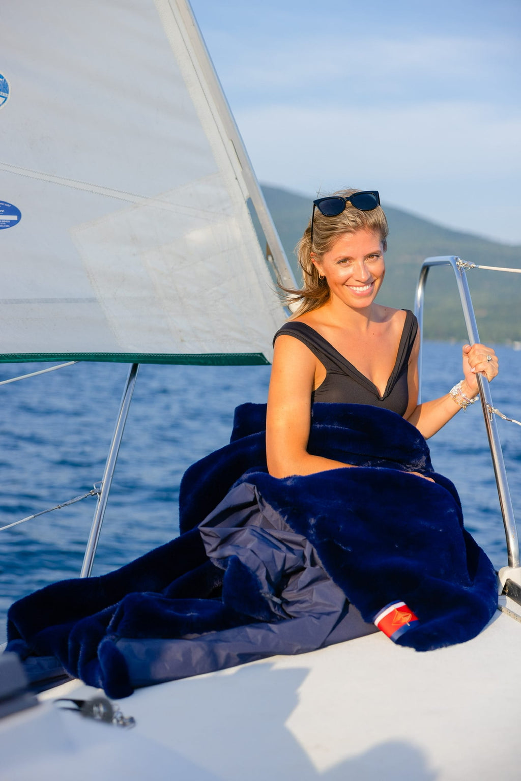 Large outdoor blanket, navy outer with plush lining on sailboat