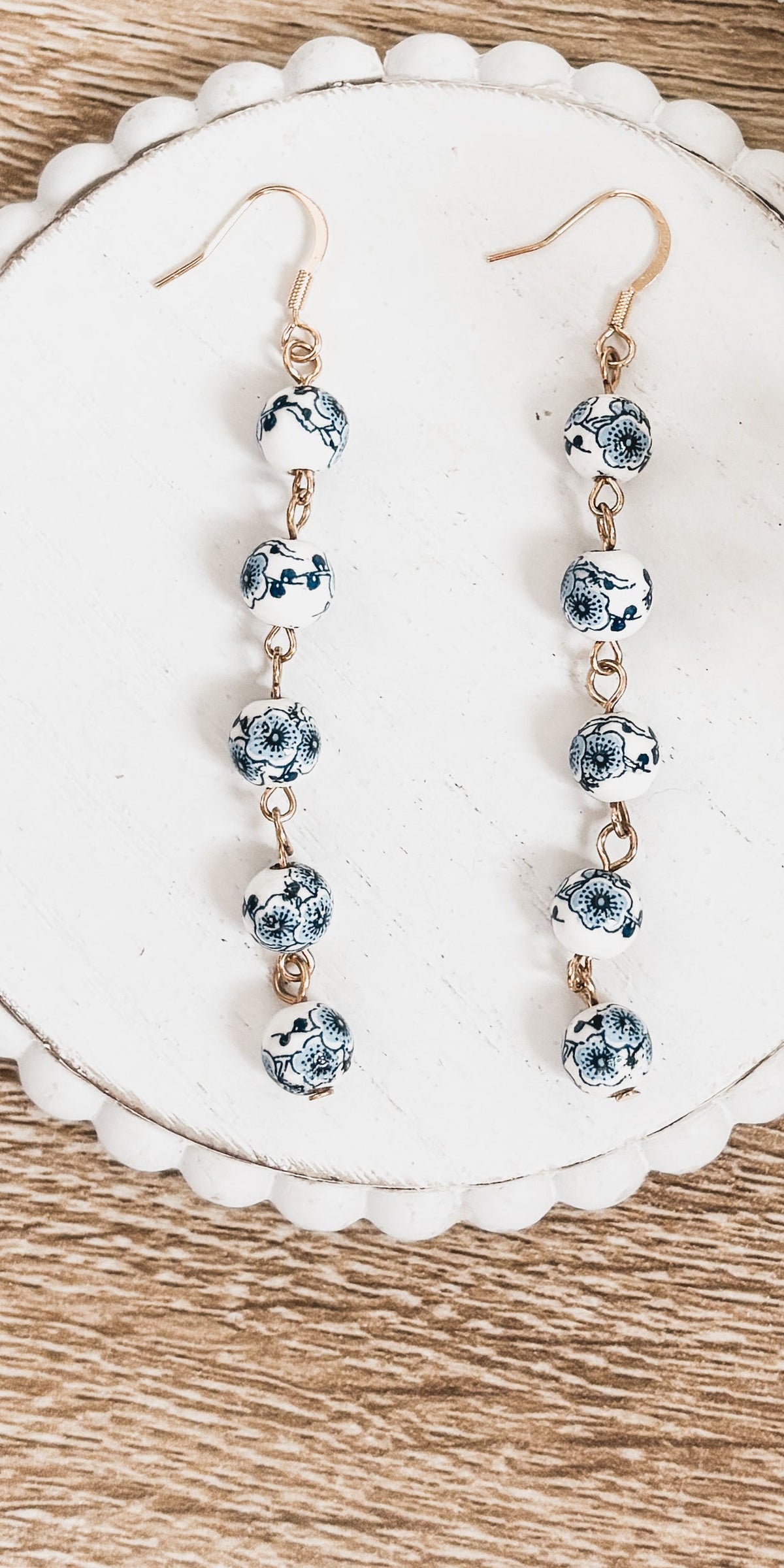 Blue porcelain bead drop earrings, gold-tone hooks and five round bead charms