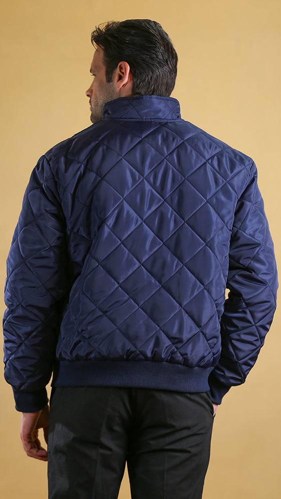 Navy quilted bomber jacket back view with ribbed collar and cuffs