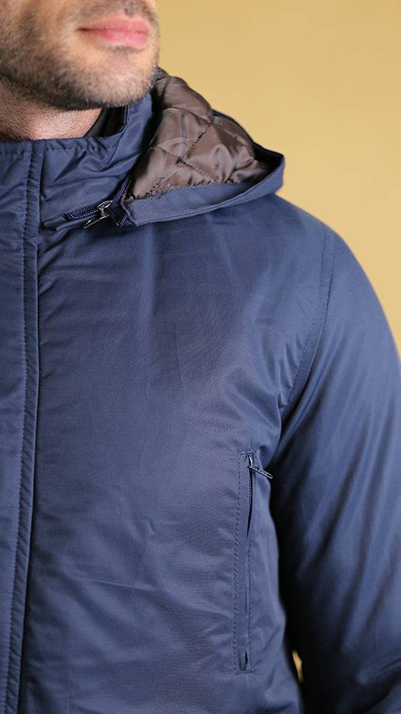 Navy bomber jacket with metal zipper and hood, close-up